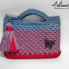 Pochette fatta a mano artigianale lilla con base fucsia e manici azzurro polvere