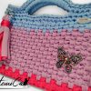 Pochette fatta a mano artigianale lilla con base fucsia e manici azzurro polvere